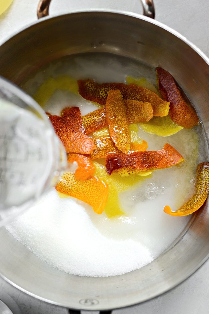 add sugar, lemon and orange peel and water to saucepan