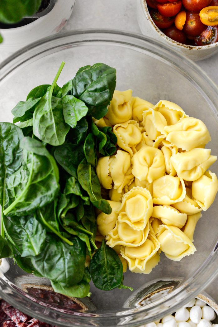 drain tortellini and add to bowl with baby spinach
