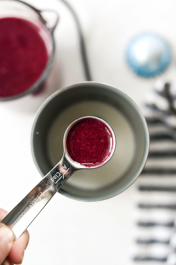 add heavy cream and blueberry syrup into a frother