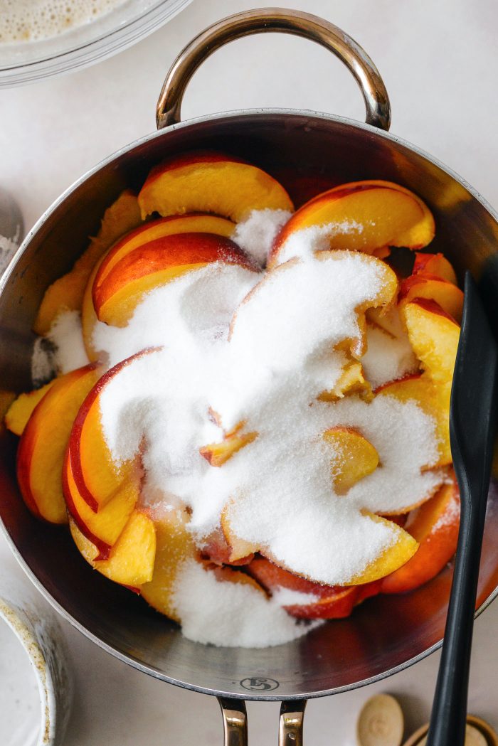 add slice peaches, lemon juice and sugar to a sauce pan