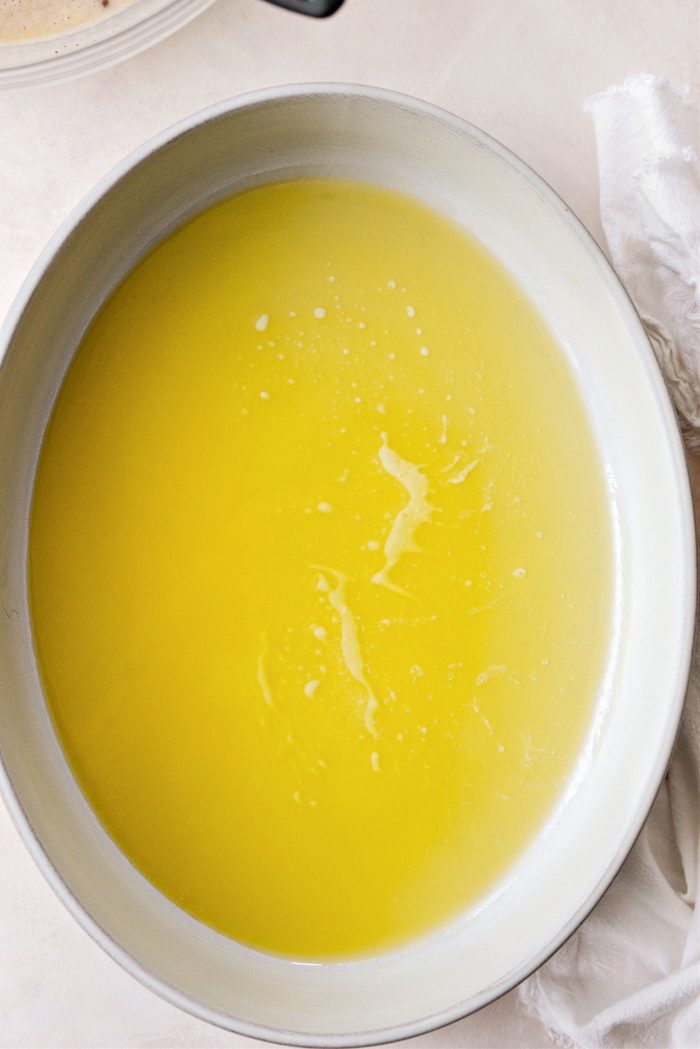 preheat oven and add melted butter to baking dish