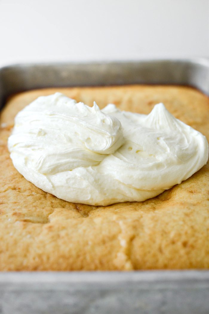 add 2/3 of the buttercream on top of the cooled cake