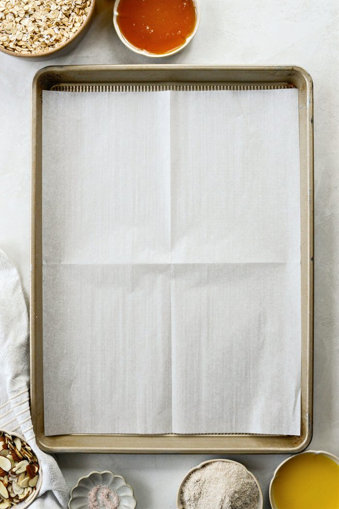 preheat oven and line a rimmed baking sheet with parchment paper