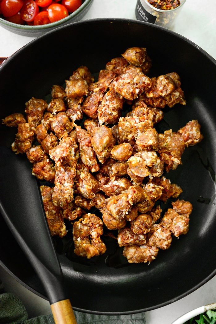 cook chopped Italian sausage in skillet with olive oil