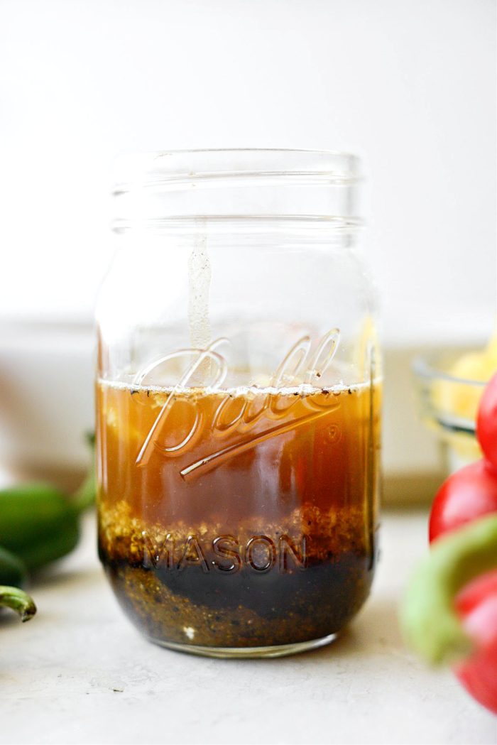 measure marinade ingredients in a jar