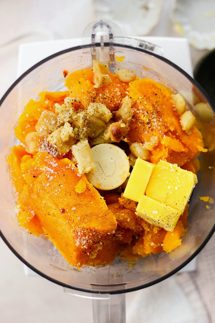 add squash, roasted garlic, butter, salt and pepper