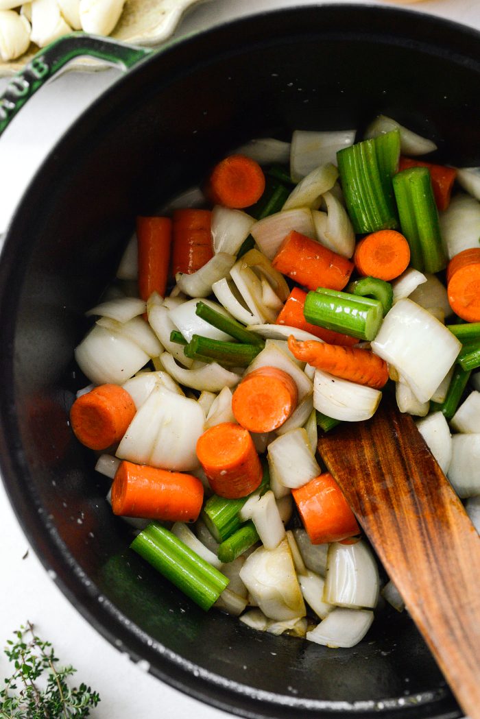 add veggies to pot and scrape bottom of the pot with a wooden spatula