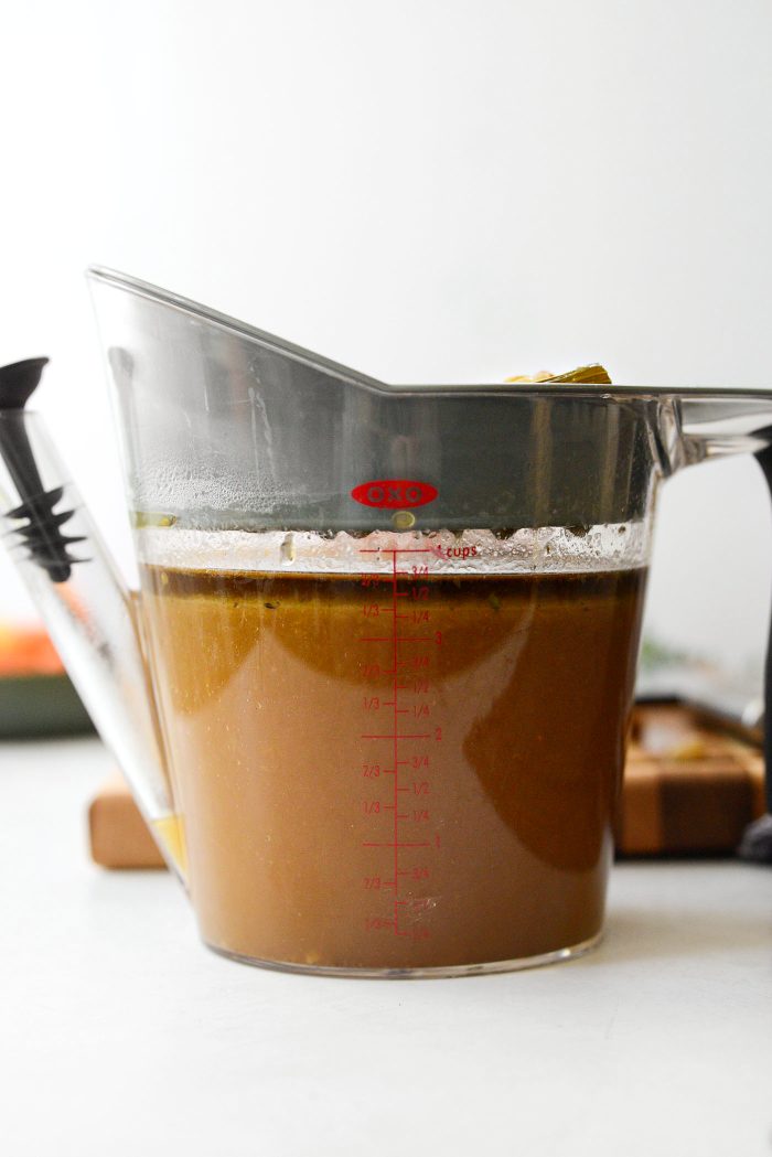 strain braising liquids into a fat separator
