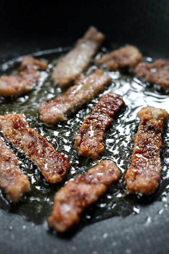 work in batches frying beef