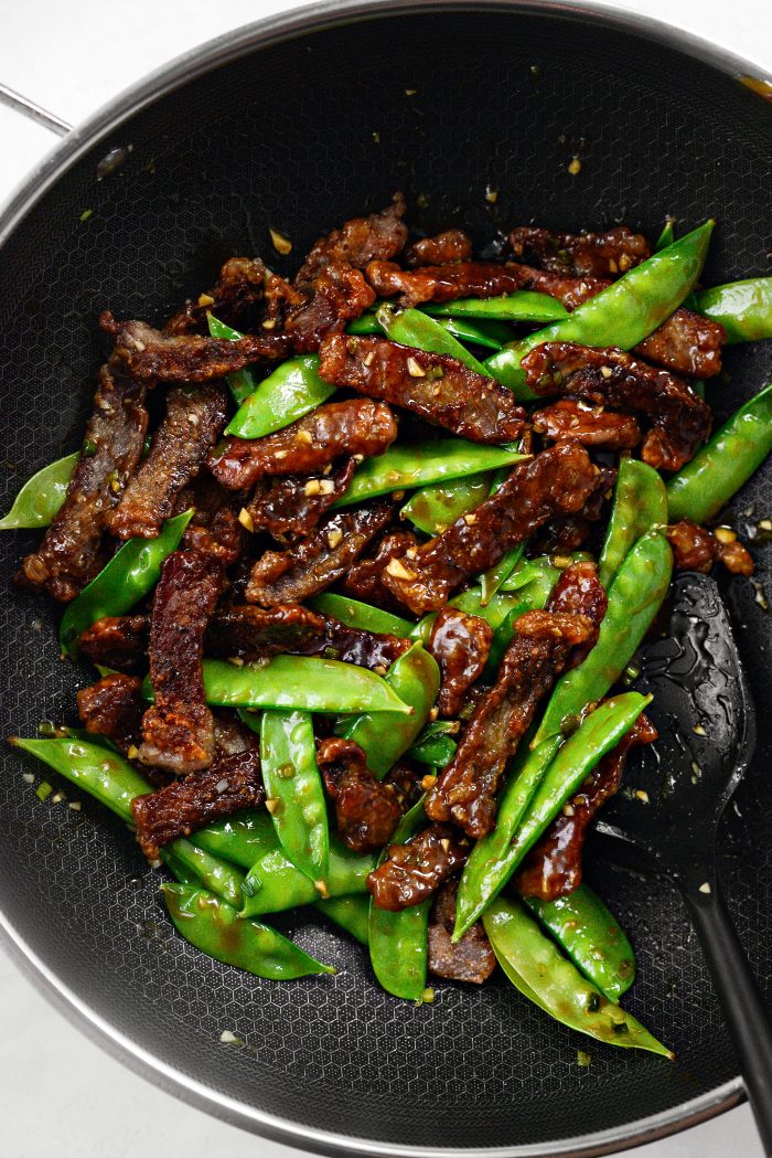 toss to coat and simmer until sauce thickens