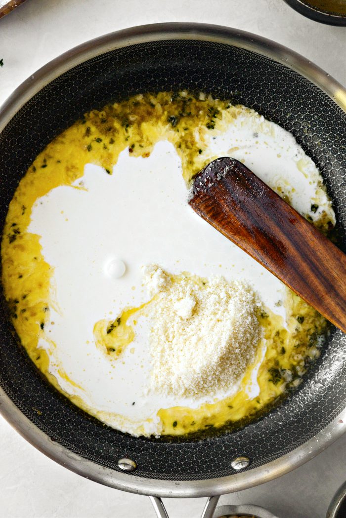 once reduced, pour in heavy cream and parmesan cheese