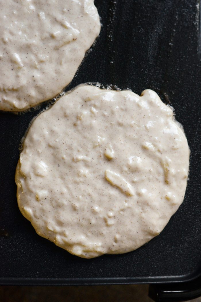 pour pancake batter onto buttered griddle