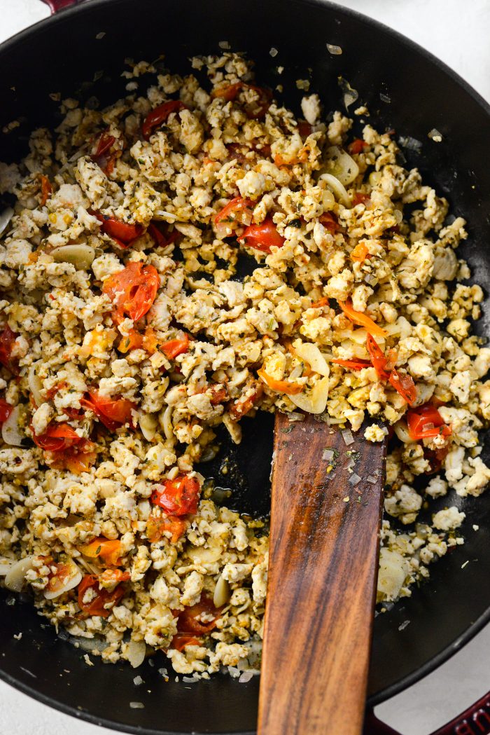 Stir and cook until tomatoes burst