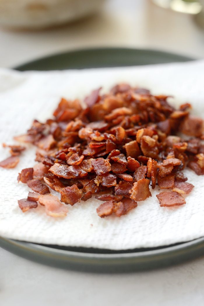 use a slotted spoon to transfer bacon to a paper towel lined plate