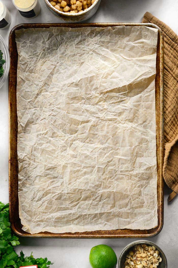 preheat oven and line rimmed baking sheet with parchment paper