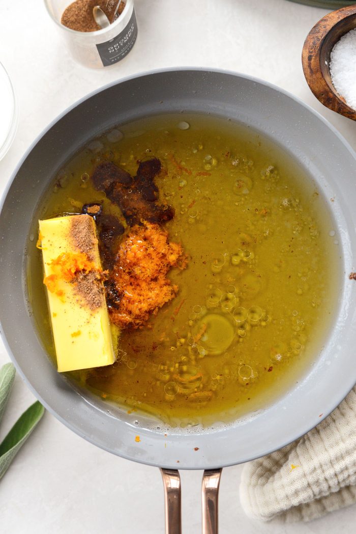 add butter, bourbon, maple syrup, orange zest, cinnamon and nutmeg