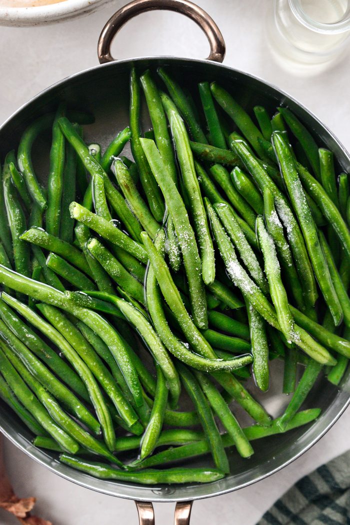 add green beans with fine salt to boiling water
