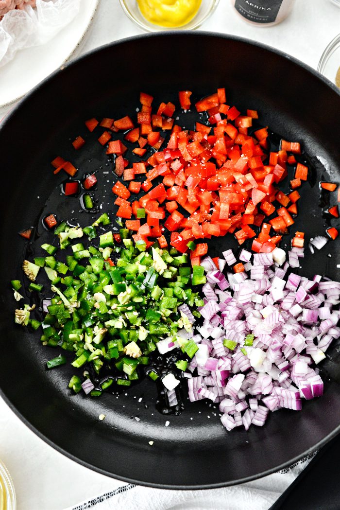 add oil, peppers and onion with a pinch of salt