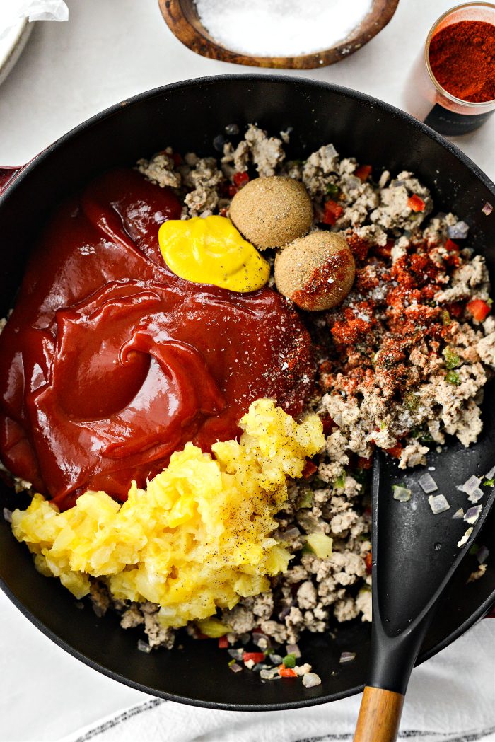 add in ketchup, mustard, water, vinegar, pineapple, paprika, salt and pepper