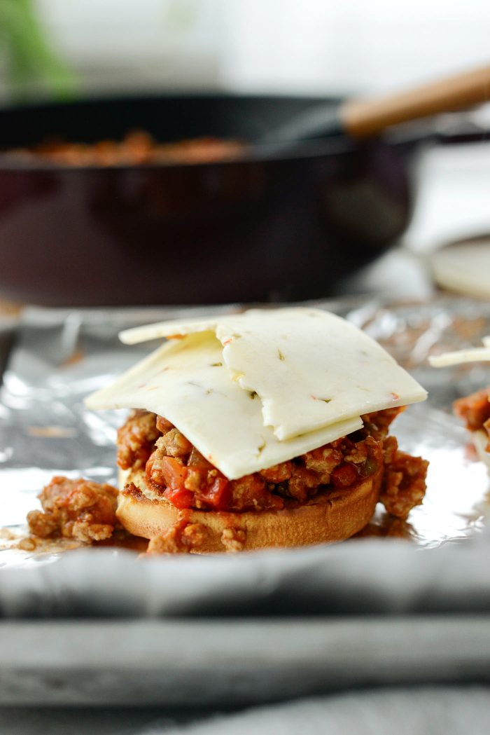 toast buns and top with sloppy Jane mixture and cheese