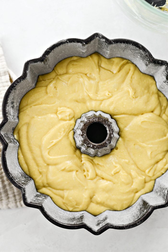 Spoon the cake batter into the prepared cake pan.