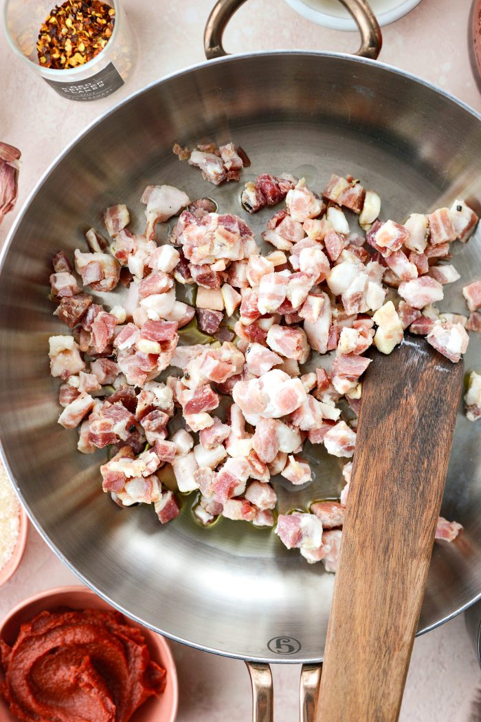 add oil and pancetta to skillet