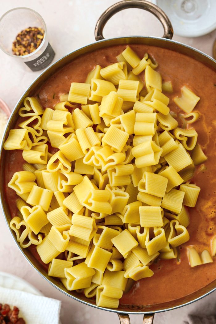 add drained pasta and pasta water to sauce