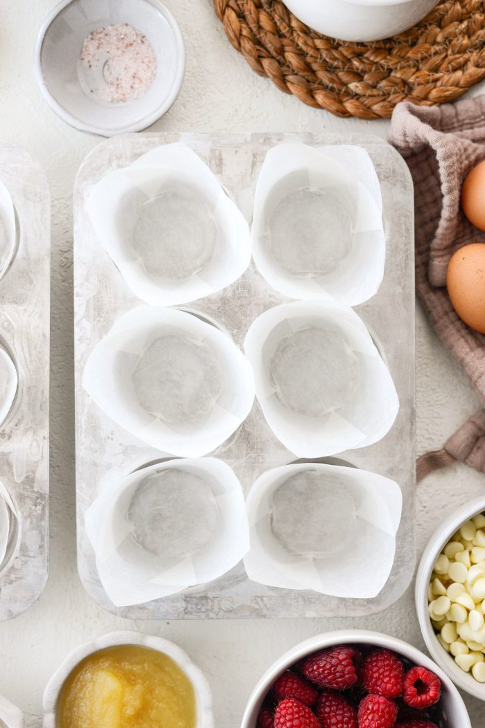 preheat oven and line a muffin tin