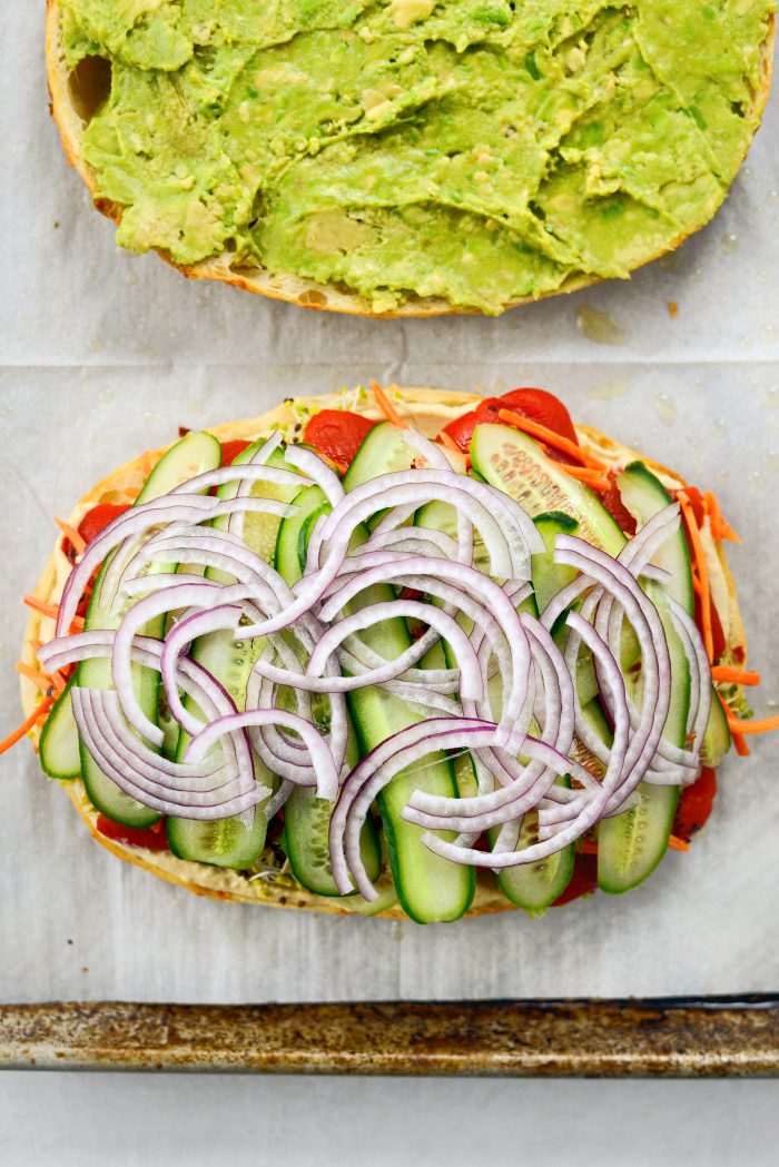 top peppers with sliced cucumber and red onion