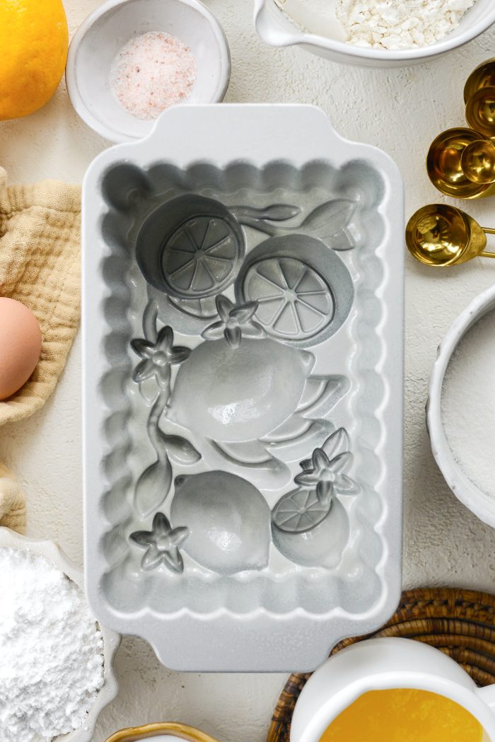 preheat oven and grease cake pan