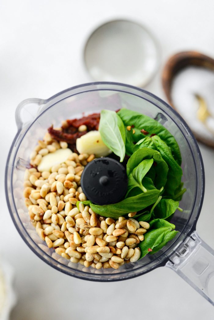 add tomatoes, basil, toasted pine nuts and galric