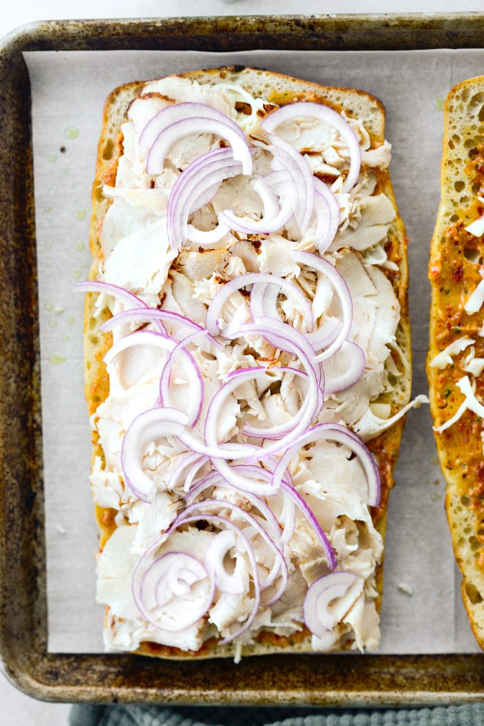 Add chicken ranch meat and red onion to top and bottom halves and return to oven.
