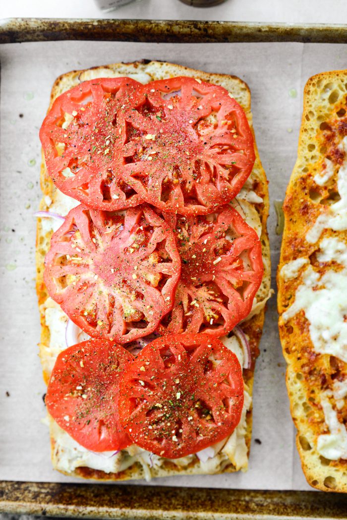 Take it out, add tomatoes and season.