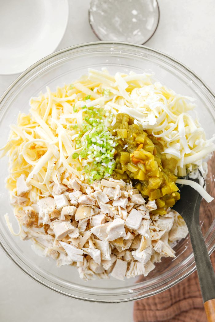 add chicken cheese, green onions and green chiles