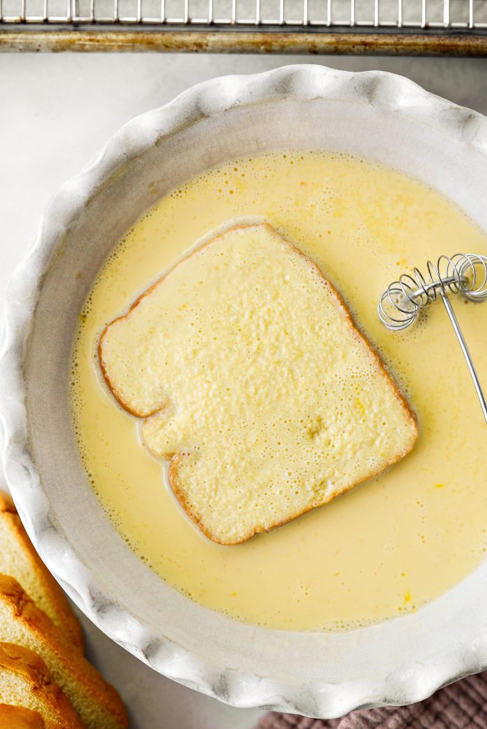 dip a slice of bread into the egg mixture