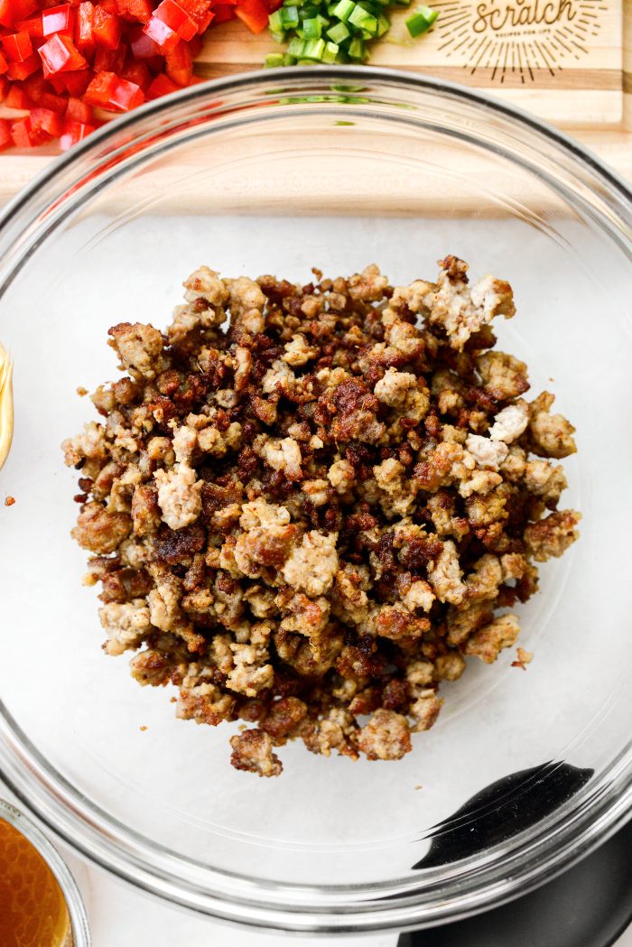 add pork to a bowl using a slotted spoon