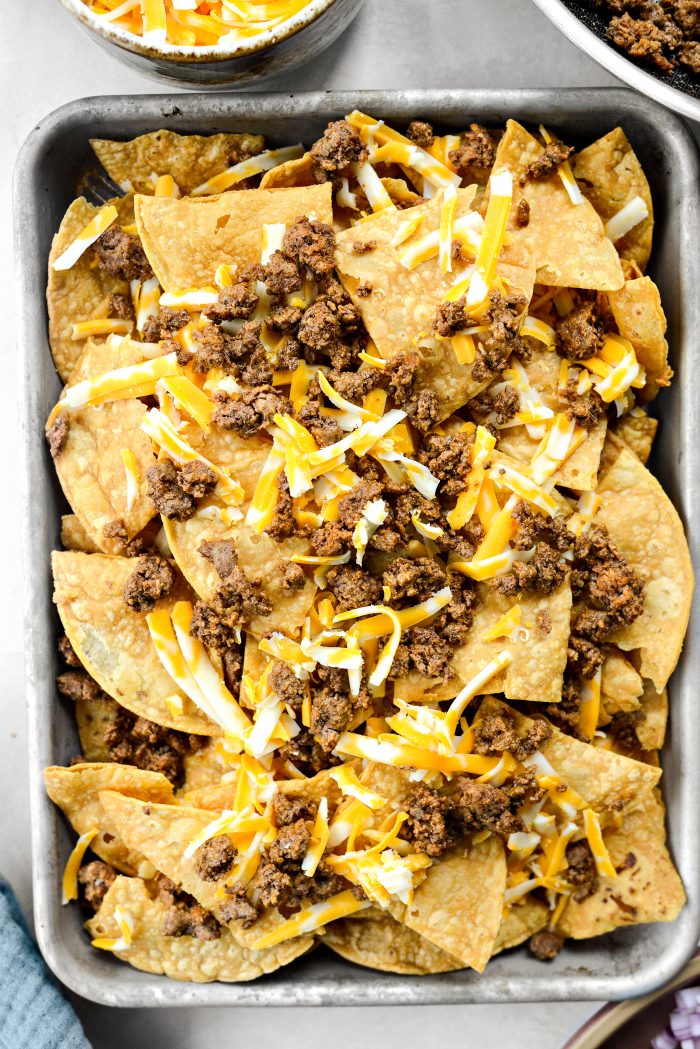 add a second layer of chips, cheese and meat