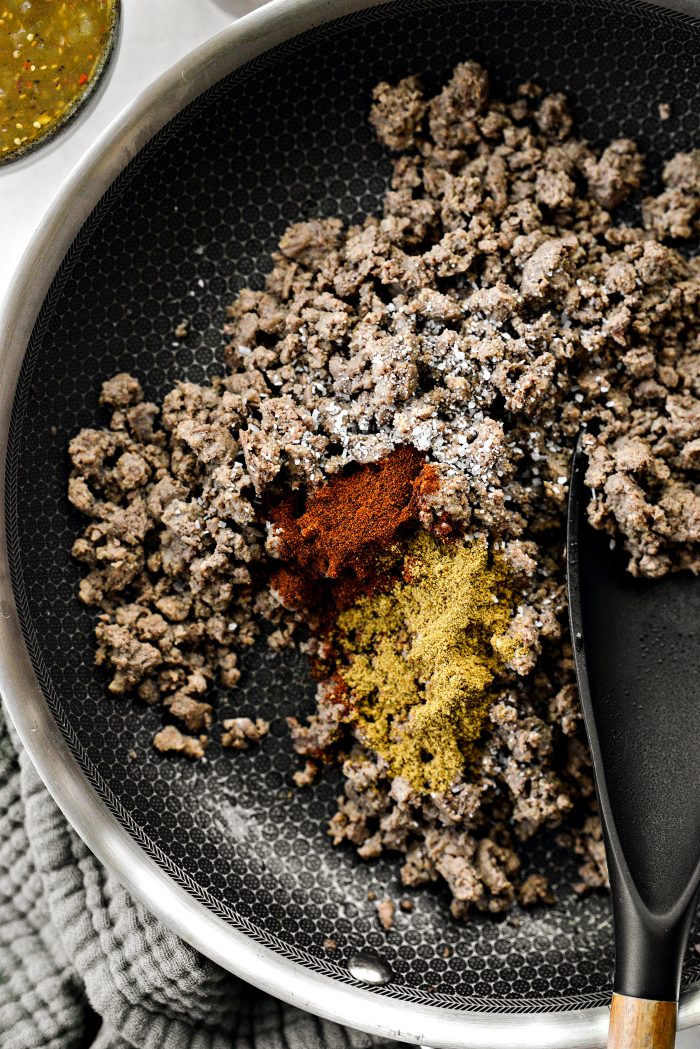 Season ground beef with cumin, chipotle powder and salt