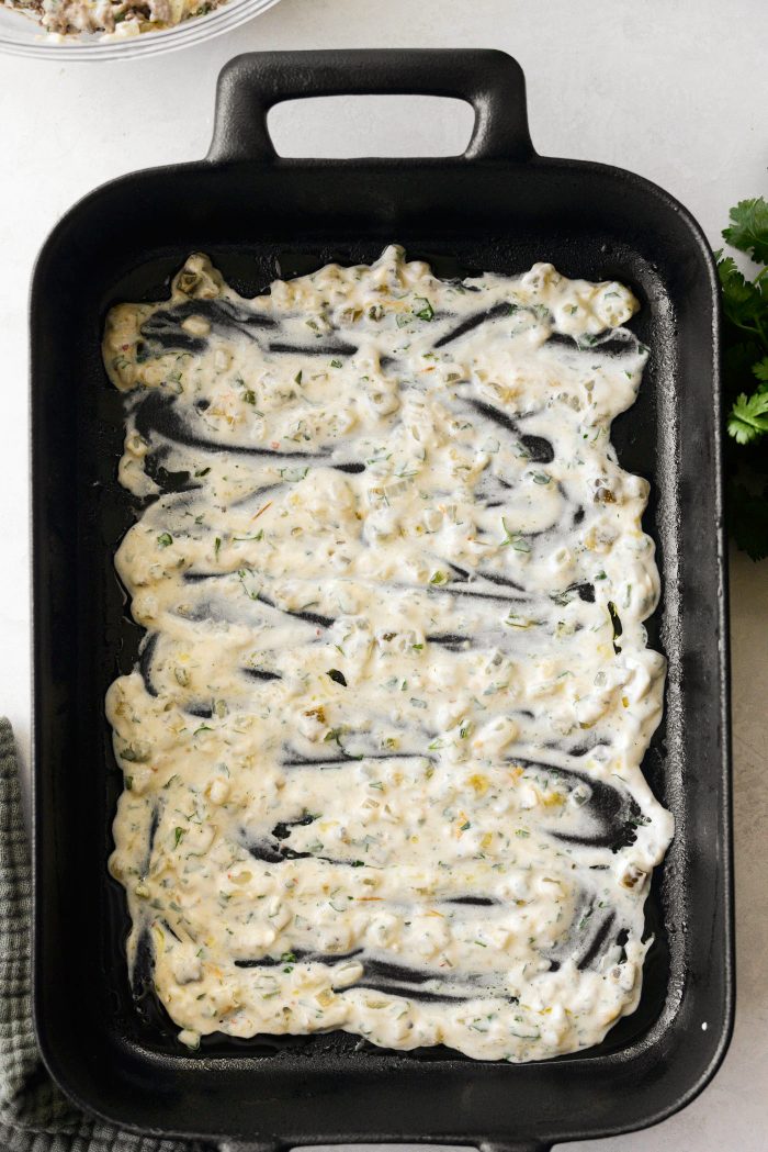 add some sauce to prepared pan