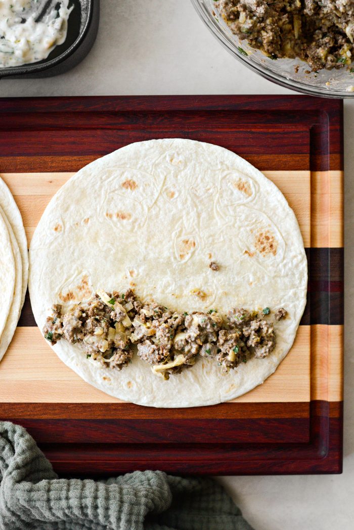 add some filling to a soft flour tortilla