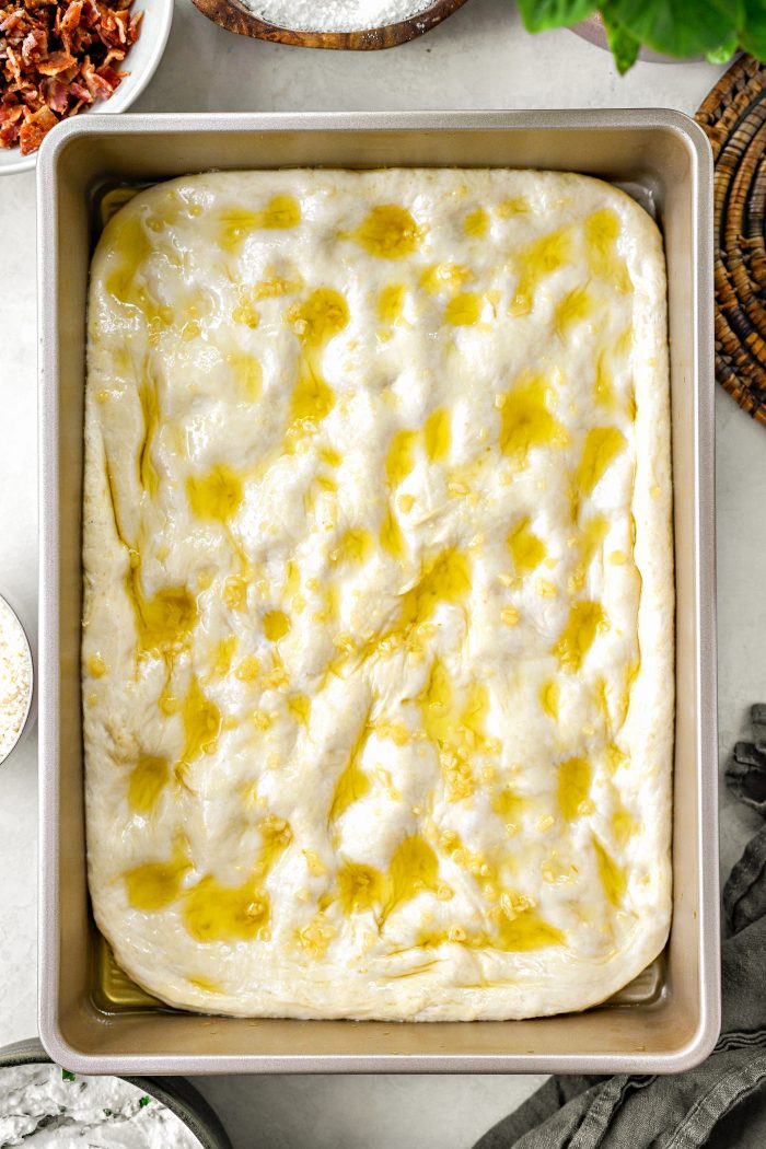 garlic oil on focaccia dough