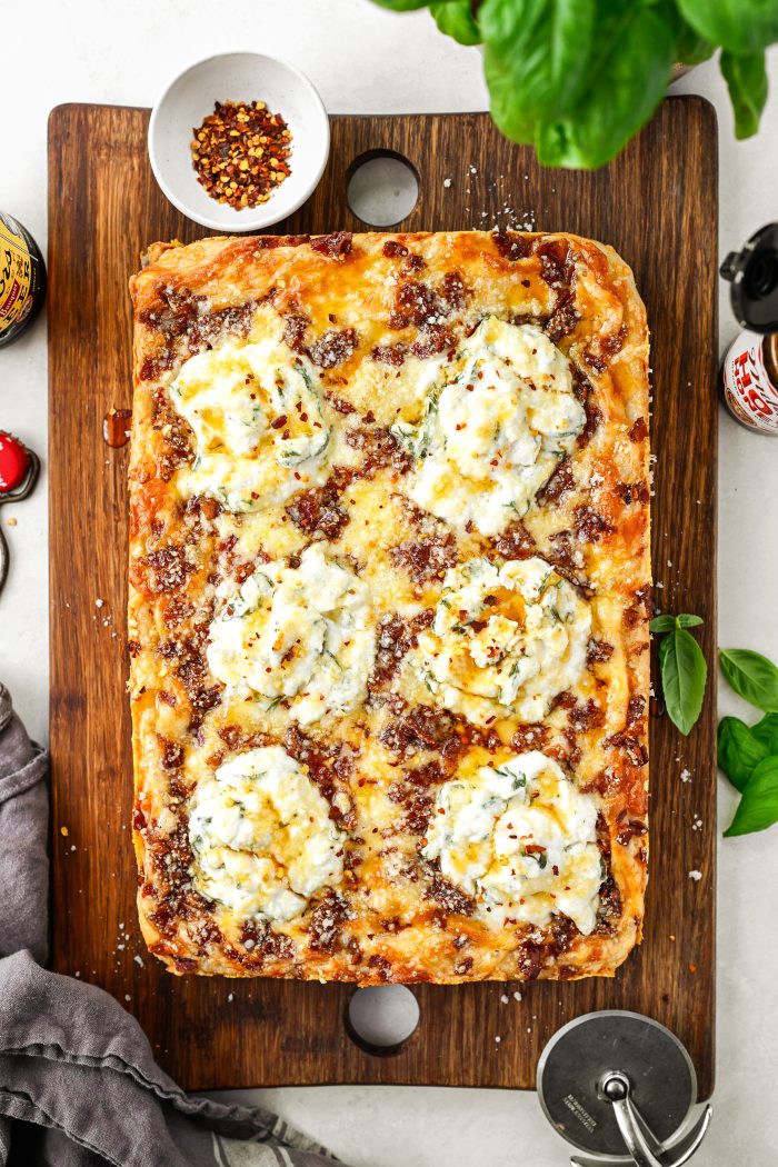 drizzle with hot honey and sprinkle generously with red pepper flakes