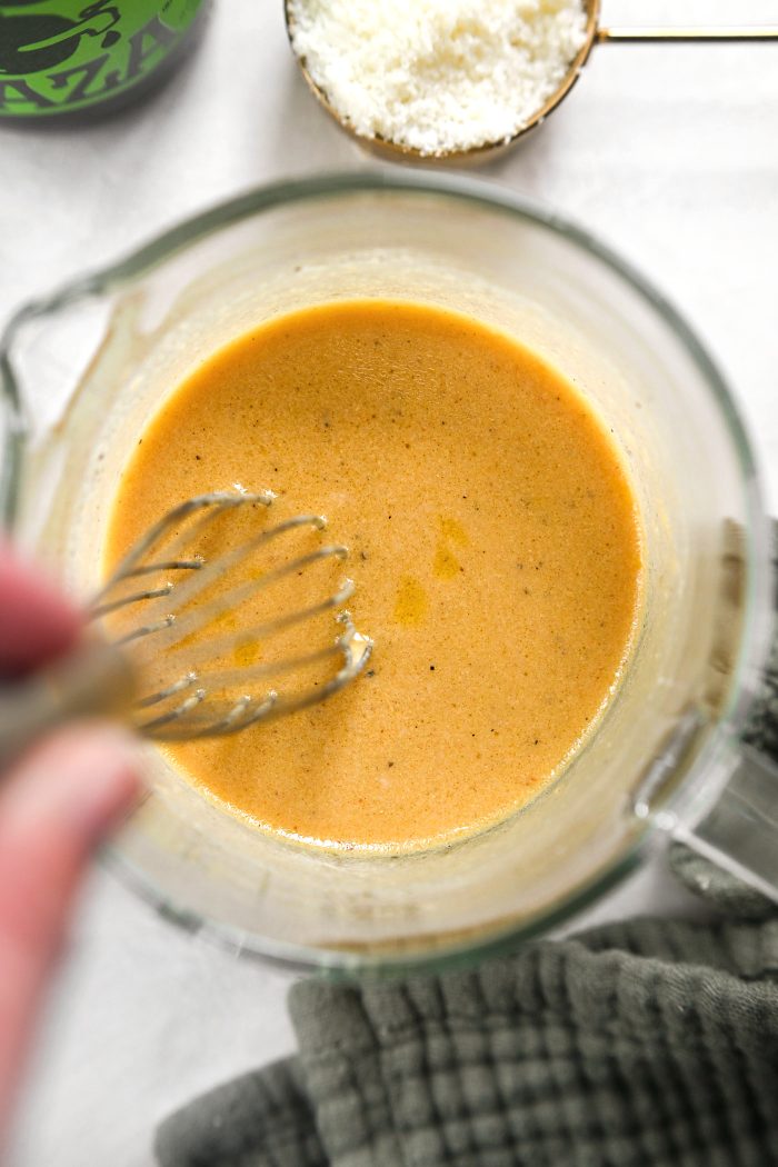 whisk to combine while pouring in olive oil