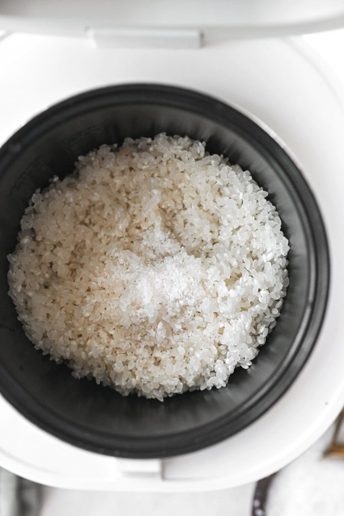 add to rice cooker with salt