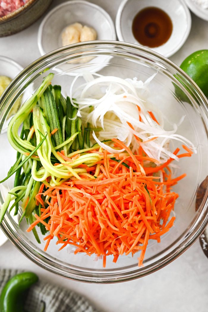 add in cucumber, daikon and carrot ribbons