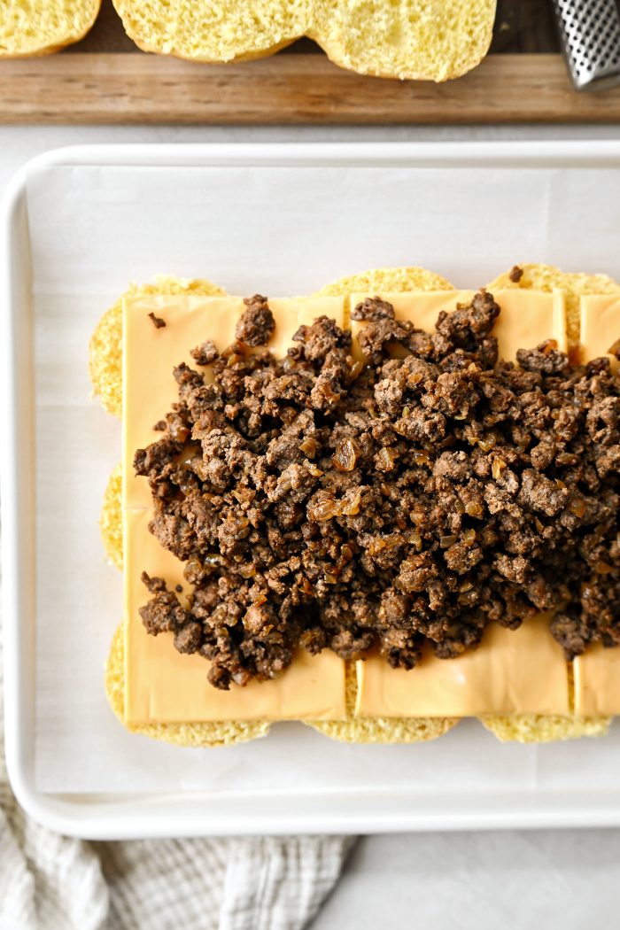 top with cheese and beef and onion mixture